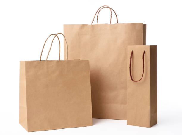 Three brown paper shopping bag isolated on white with clipping path.